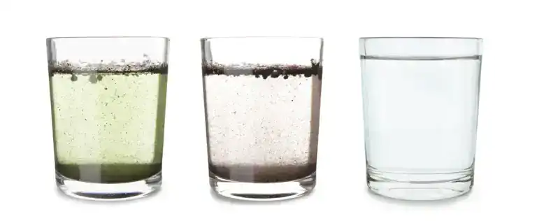 Three glasses of water side by side: the first with green and black particles, the second with black sediment settling at the bottom, and the third demonstrates the clarity achieved with Water Filtration Systems in Lake County, FL.